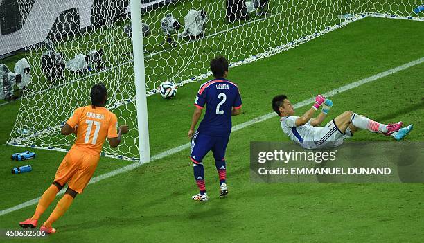 Japan's goalkeeper Eiji Kawashima reacts after Ivory Coast's first goal during a Group C football match between Ivory Coast and Japan at the...