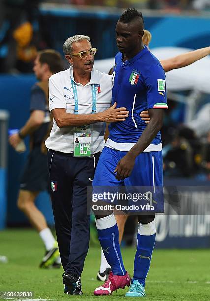 Enrico Castellatti, Italy's doctor, speaks with Mario Balotelli during the 2014 FIFA World Cup Brazil Group D match between England and Italy at...