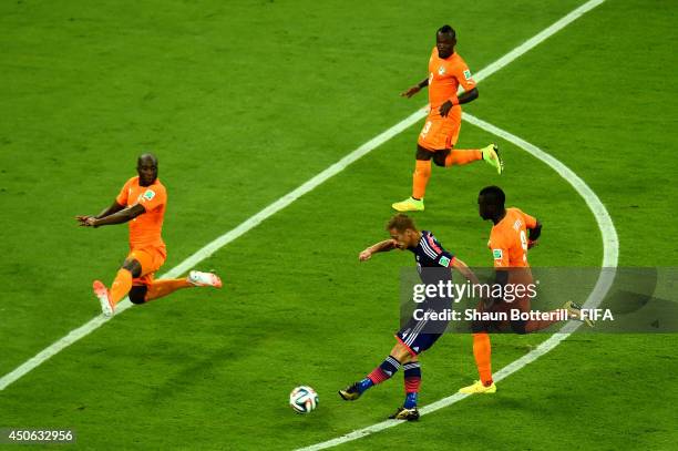 Keisuke Honda of Japan attempts a shot on goal during the 2014 FIFA World Cup Brazil Group C match between Cote D'Ivoire and Japan at Arena...