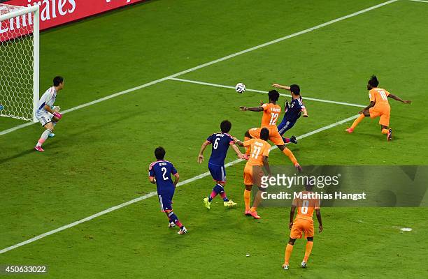 Gervinho of the Ivory Coast scores his team's second goal on a header past goalkeeper Eiji Kawashima of Japan during the 2014 FIFA World Cup Brazil...
