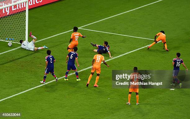 Gervinho of the Ivory Coast scores his team's second goal on a header past goalkeeper Eiji Kawashima of Japan during the 2014 FIFA World Cup Brazil...