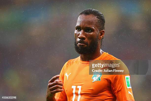 Didier Drogba of the Ivory Coast looks on in the rain during the 2014 FIFA World Cup Brazil Group C match between the Ivory Coast and Japan at Arena...