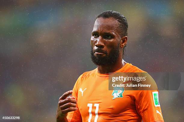 Didier Drogba of the Ivory Coast looks on in the rain during the 2014 FIFA World Cup Brazil Group C match between the Ivory Coast and Japan at Arena...