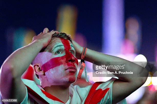 Fans watch the England vs Italy match at The Isle of Wight Festival at Seaclose Park on June 14, 2014 in Newport, Isle of Wight.