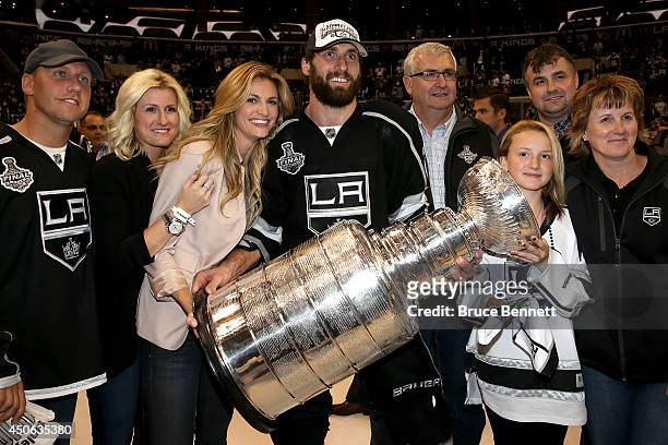 Tv personality Erin Andrews and Jarret Stoll of the Los Angeles Kings celebrate with family and the Stanley Cup after the Kings 3-2 double overtime...