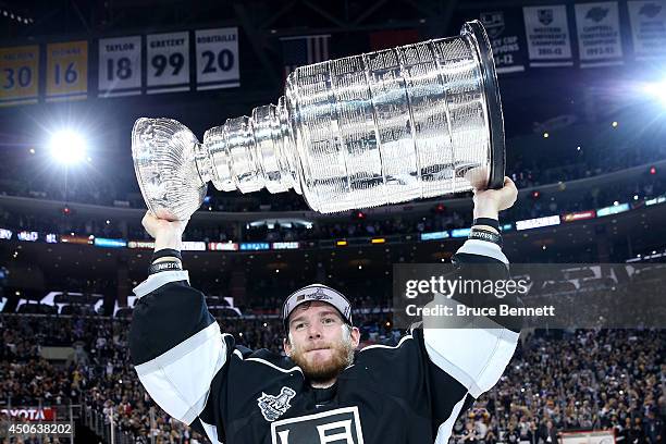 Jonathan Quick of the Los Angeles Kings celebrates with the Stanley Cup after the Kings 3-2 double overtime victory against the New York Rangers in...