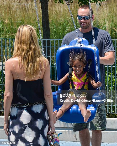 June 21: Heidi Klum and Martin Kristen with Lou Samuel are seen on June 21, 2013 in New York City.