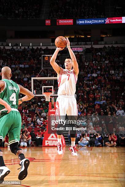Jeremy Lin of the Houston Rockets shoots against Keith Bogans of the Boston Celtics on November 19, 2013 at the Toyota Center in Houston, Texas. NOTE...