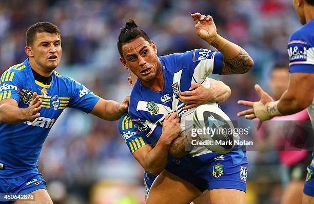 Reni Maitua of the Bulldogs offloads during the round 14 NRL match between the Canterbury-Bankstown Bulldogs and the Parramatta Eels at ANZ Stadium...