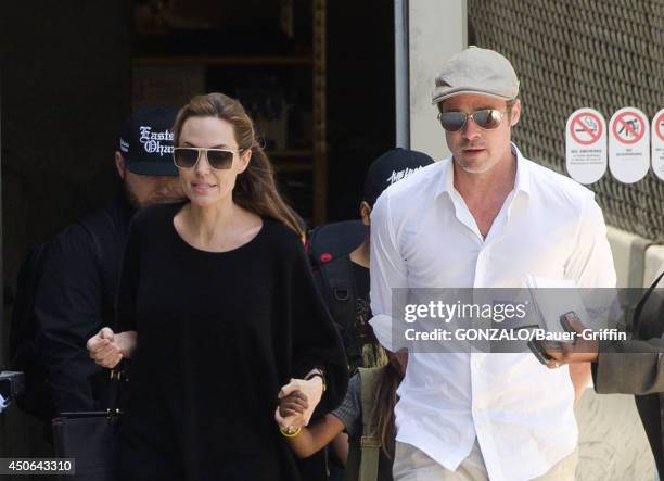 Angelina Jolie and Brad Pitt are seen at LAX on June 14, 2014 in Los Angeles, California.