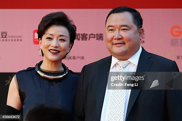 Yang Lan and his husband Wu Zhen arrive for the red carpet of the 17th Shanghai International Film Festival at Shanghai Grand Theatre on June 14,...