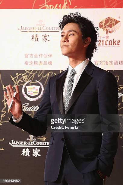 Actor Chen Kun arrives for the red carpet of the 17th Shanghai International Film Festival at Shanghai Grand Theatre on June 14, 2014 in Shanghai,...