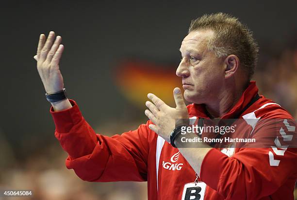 Head coach Michael Biegler of Poland gestures during the IHF World Championship 2015 Playoff Leg Two between Germany and Poland at Getec-Arena on...