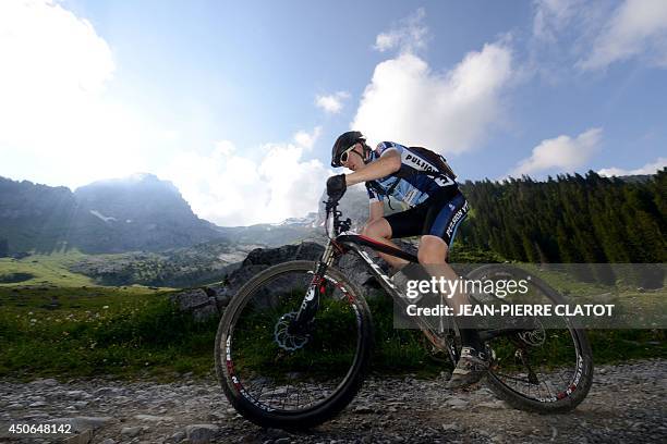 Rider competes during the "VTT, Roc des Alpes" cycling race on June 15, 2014 in La Clusaz, southern France. Some 4,100 runners are registered to take...