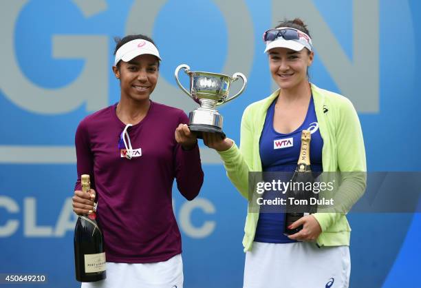 Raquel Kops-Jones and Abigail Spears of the United States pose with the trophy after the Doubles Final during Day Seven of the Aegon Classic at...