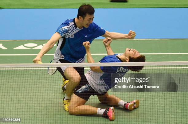 Yong Dae Lee and team mate Yeon Seong Yoo of Korea celebrate victory over Mohammad Ahsan and Hendra Setiawan of Indonesia during day six of Badminton...