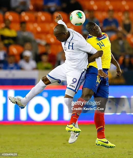 Jerry Palacios of Honduras battles for a header against Segundo Castillo of Ecuador during an international friendly match at BBVA Compass Stadium on...