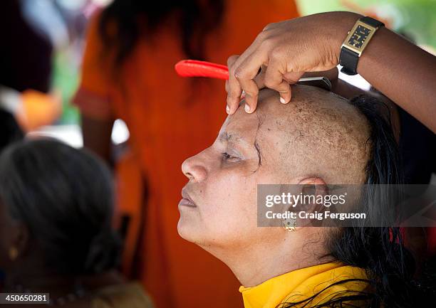 Head shaving at Thaipusam Festival. Many pilgrims prepare for the day by cleansing, fasting and abstinence before having their head shaved. Thaipusam...