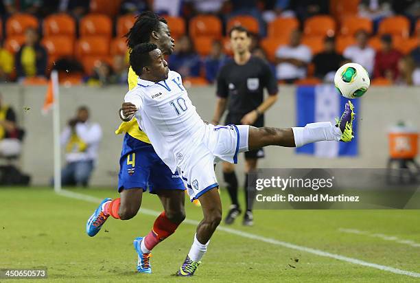Marvin Chavez of Honduras jumps for the ball against Juan Carlos Paredes of Ecuador during an international friendly match at BBVA Compass Stadium on...