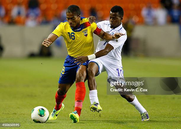Antonio Valencia of Ecuador battles for the ball against Marvin Chavez of Honduras during an international friendly match at BBVA Compass Stadium on...