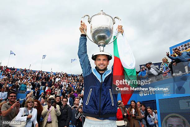 Grigor Dimitrov of Bulgaria celebrates with the winners trophy after defeating Feliciano Lopez of Spain during their Men's Singles Final on day seven...