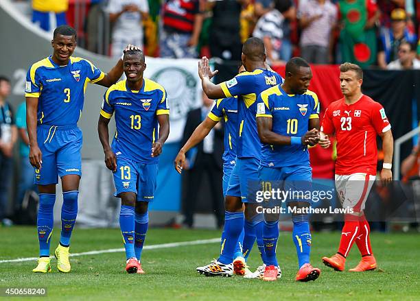 Enner Valencia of Ecuador celebrates with teammates after scoring his team's first goal during the 2014 FIFA World Cup Brazil Group E match between...