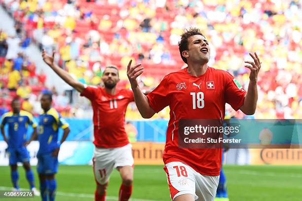 Admir Mehmedi of Switzerland celebrates scoring his team's first goal during the 2014 FIFA World Cup Brazil Group E match between Switzerland and...