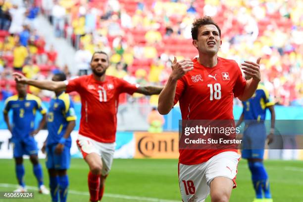 Admir Mehmedi of Switzerland celebrates scoring his team's first goal during the 2014 FIFA World Cup Brazil Group E match between Switzerland and...