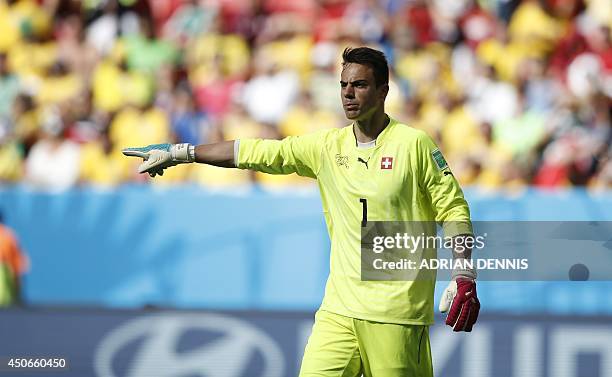 Switzerland's goalkeeper Diego Benaglio reacts during a Group E football match between Switzerland and Ecuador at the Mane Garrincha National Stadium...