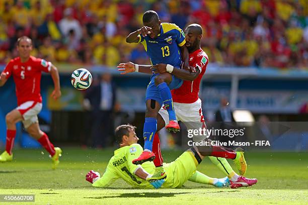 Enner Valencia of Ecuador collides with Diego Benaglio of Switzerland during the 2014 FIFA World Cup Brazil Group E match between Switzerland and...