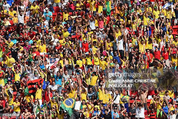 Football fans react during a Group E football match between Switzerland and Ecuador at the Mane Garrincha National Stadium in Brasilia during the...