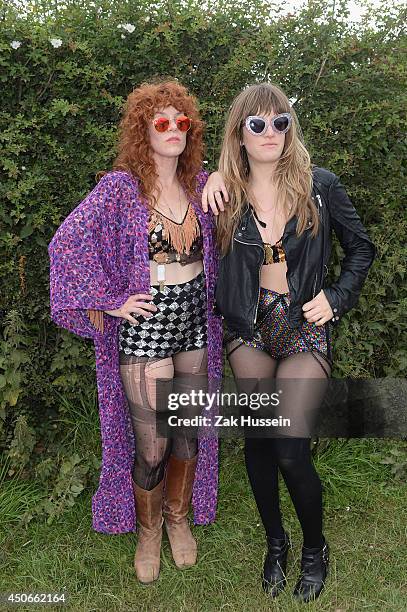 Julie Edwards and Lindsey Troy of Deap Vally pose backstage at The Isle of Wight Festival at Seaclose Park on June 15, 2014 in Newport, Isle of Wight.