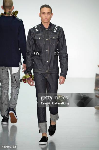 Model walks the runway at the Matthew Miller Spring Summer 2015 fashion show during London Menswear Fashion Week on June 15, 2014 in London, United...