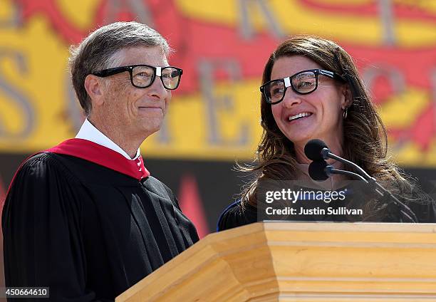 Microsoft founder and chairman Bill Gates shares the stage with his wife Melinda during the 123rd Stanford commencement ceremony June 15, 2014 in...