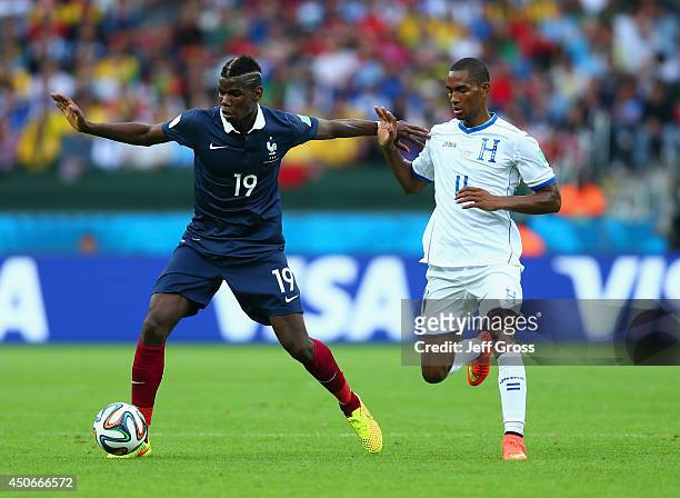 Paul Pogba of France dribles past Jerry Bengtson of Honduras during the 2014 FIFA World Cup Brazil Group E match between France and Honduras at...
