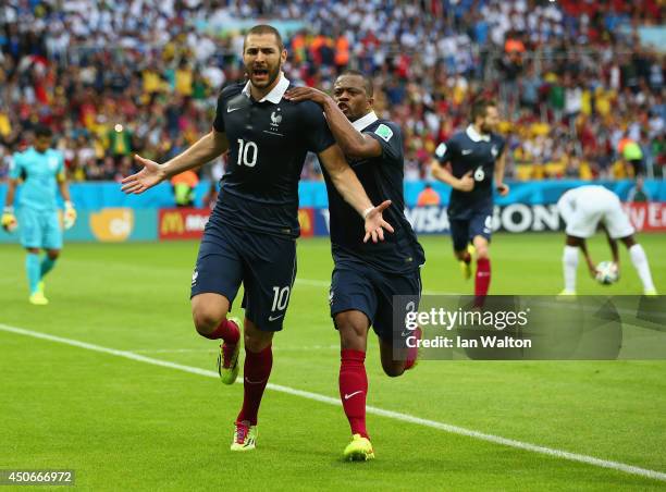 Karim Benzema of France celebrates scoring his team's first goal on a penalty kick with Patrice Evra during the 2014 FIFA World Cup Brazil Group E...