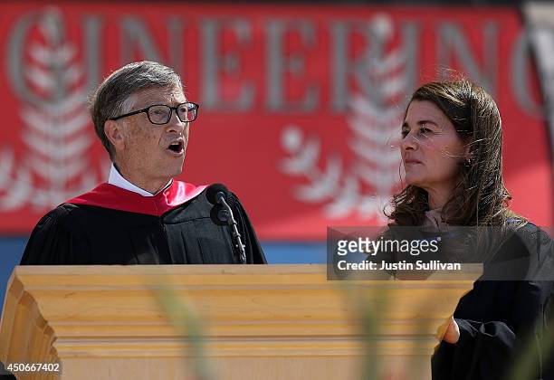 Microsoft founder and chairman Bill Gates speaks as his wife Melinda looks on during the 123rd Stanford commencement ceremony June 15, 2014 in...