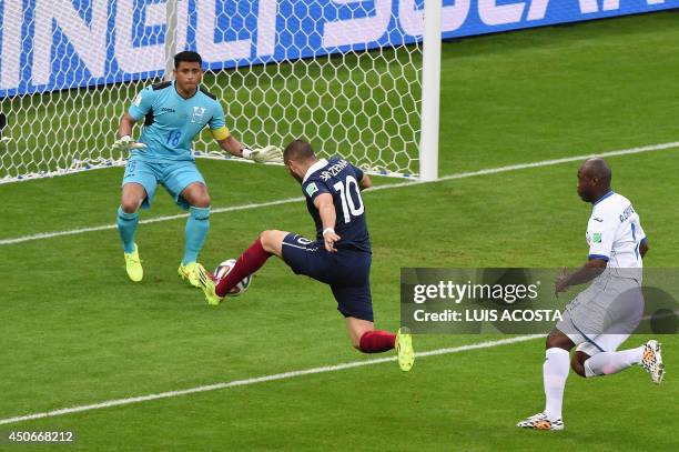 France's forward Karim Benzema scores past Honduras' goalkeeper Luis Lopez during a Group E football match between France and Honduras at the...