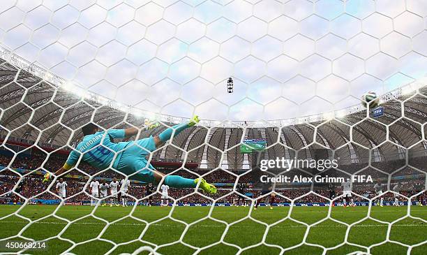 Karim Benzema of France scores the first goal from the penalty spot during the 2014 FIFA World Cup Brazil Group E match between France and Honduras...