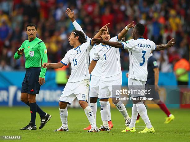 Emilio Izaguirre , Emilio Izaguirre and Maynor Figueroa of Honduras protest France's second goal with referee Sandro Ricci during the 2014 FIFA World...