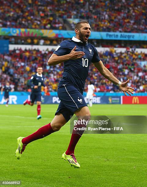 Karim Benzema of France celebrates after his shot went in off Noel Valladares of Honduras to score a goal during the 2014 FIFA World Cup Brazil Group...