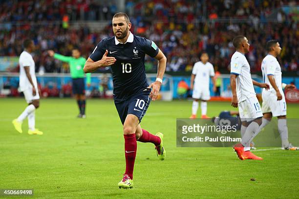 Karim Benzema of France celebrates after scoring his team's third goal during the 2014 FIFA World Cup Brazil Group E match between France and...