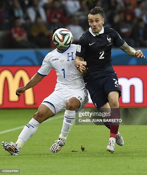 Honduras' midfielder Emilio Izaguirre challanges France's defender Mathieu Debuchy for the ball during the Group E football match between France and...