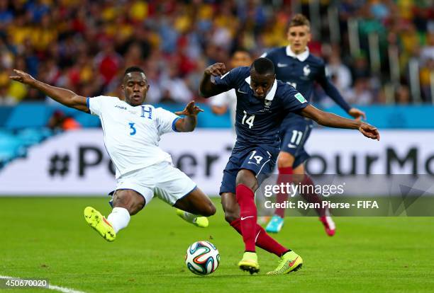 Maynor Figueroa of Honduras tries to block the shot of Blaise Matuidi of France during the 2014 FIFA World Cup Brazil Group E match between France...