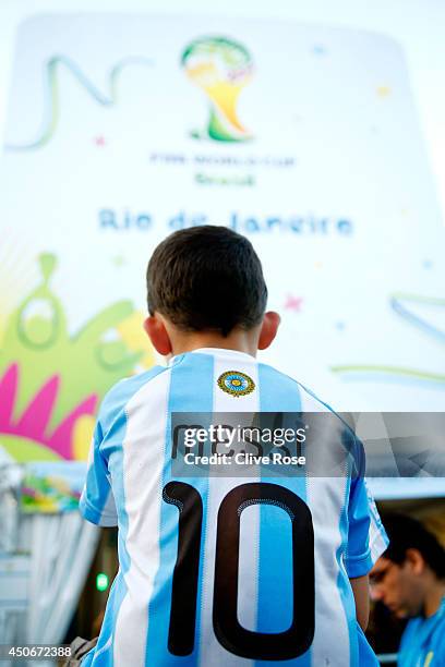 Young fan in a Lionel Messi of Argentina jersey looks on prior to the 2014 FIFA World Cup Brazil Group F match between Argentina and...