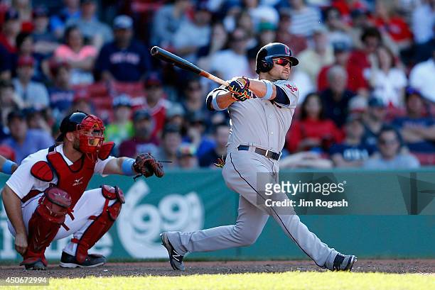 Nick Swisher of the Cleveland Indians connects for a go-ahead home run in the 11th inning against the Boston Red Sox at Fenway Park on June 15, 2014...