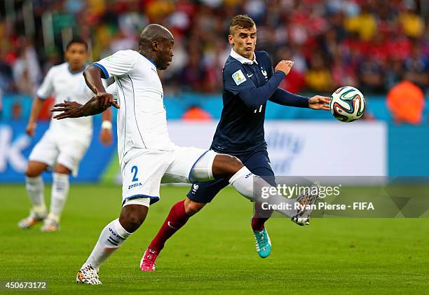 Osman Chavez of Honduras challenges Antoine Griezmann of France during the 2014 FIFA World Cup Brazil Group E match between France and Honduras at...