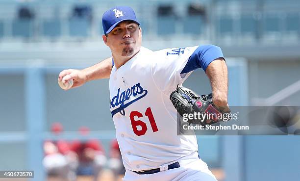 Josh Becket of the Los Angeles Dodgers throws a pitch against the Arizona Diamondbacks at Dodger Stadium on June 15, 2014 in Los Angeles, California.