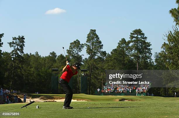 Erik Compton of the United States hits his tee shot on the ninth hole during the final round of the 114th U.S. Open at Pinehurst Resort & Country...