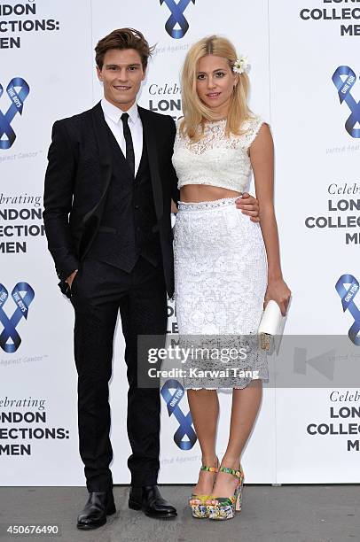 Oliver Cheshire and Pixie Lott attend the One For The Boys charity ball during the London Collections: Men SS15 on June 15, 2014 in London, England.
